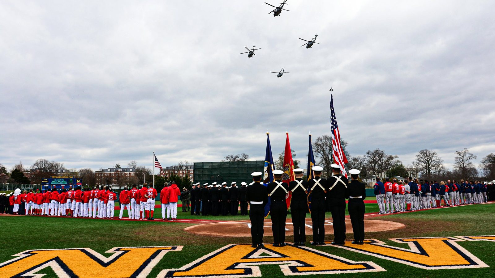 Helicopter flyover and a color guard at home plate before the Naval Academy Baseball Classic, both big-league teams on the lines