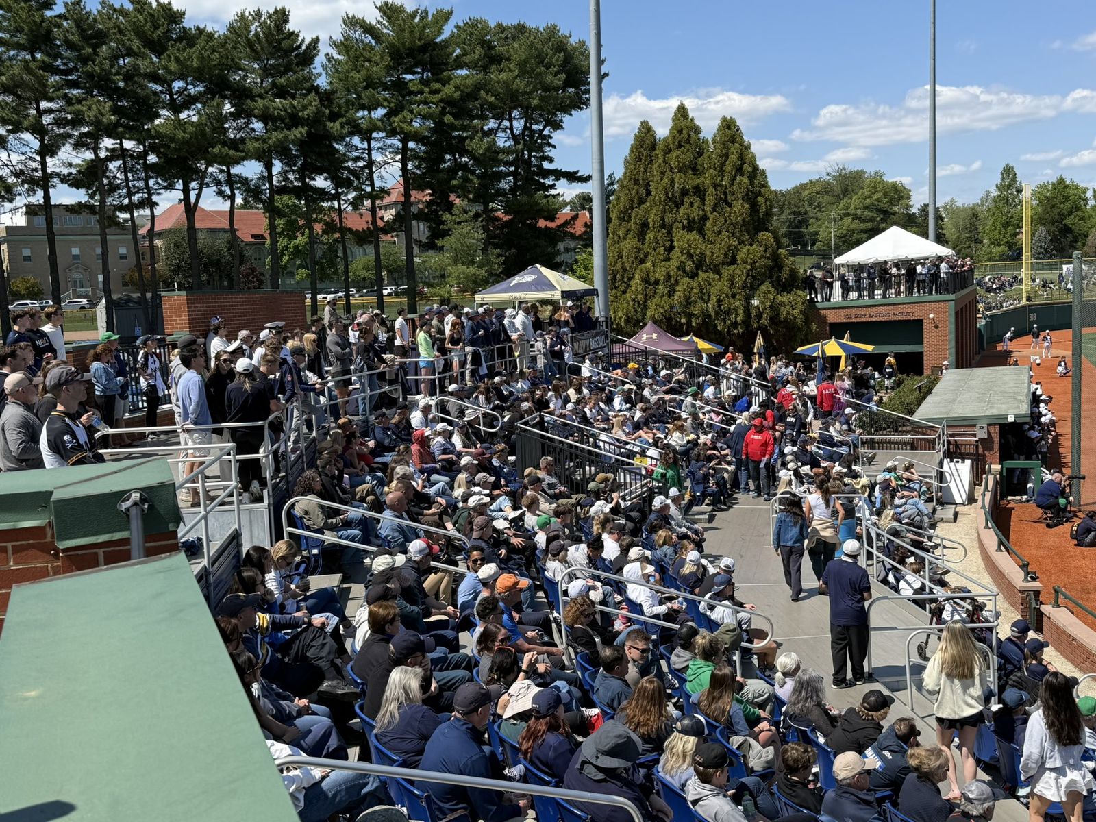 Chair-back seats full with fans lining the walkways and the deck above the batting facility