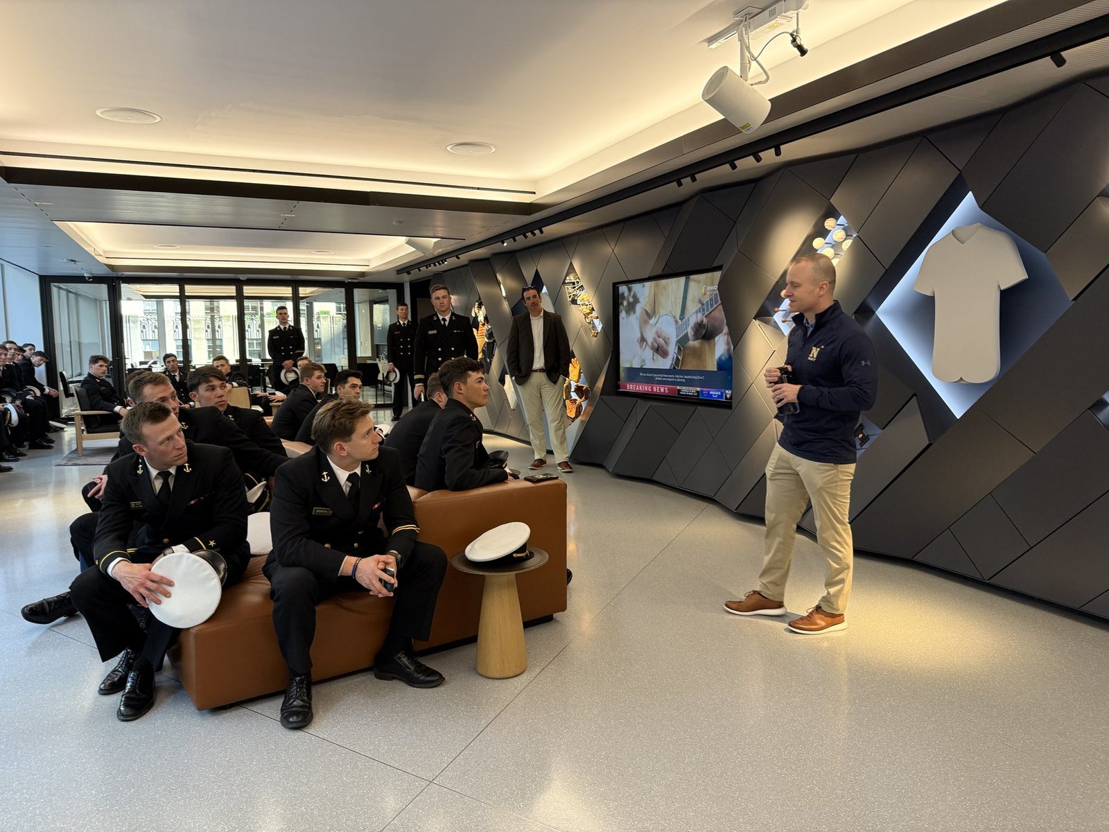 The team seated in dress blues at Major League Baseball's league offices